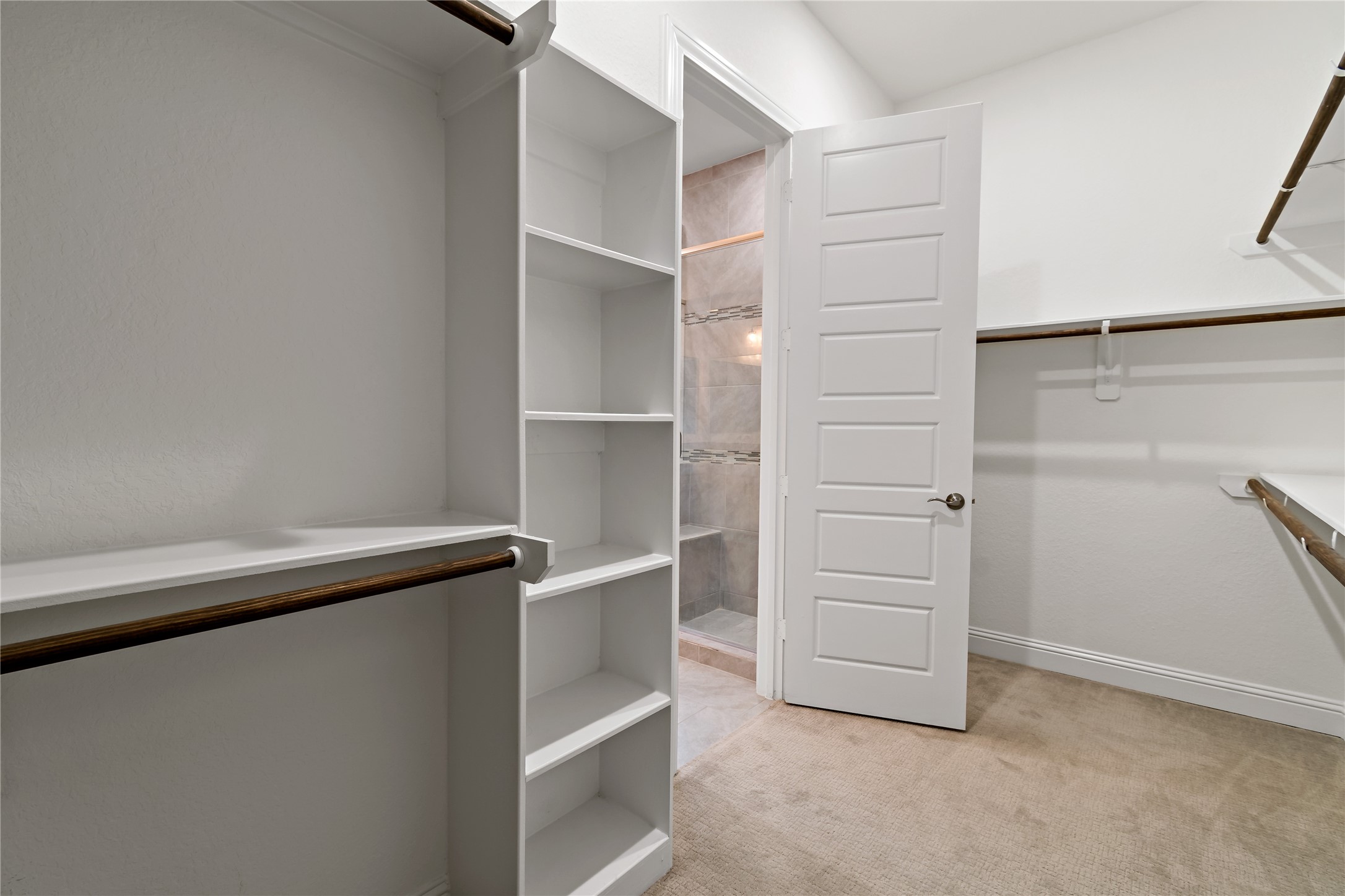 4802 Gingerwood Trace Lane Rosharon, TX 77583 - Photo 32 of 44 a view of an empty walk in closet