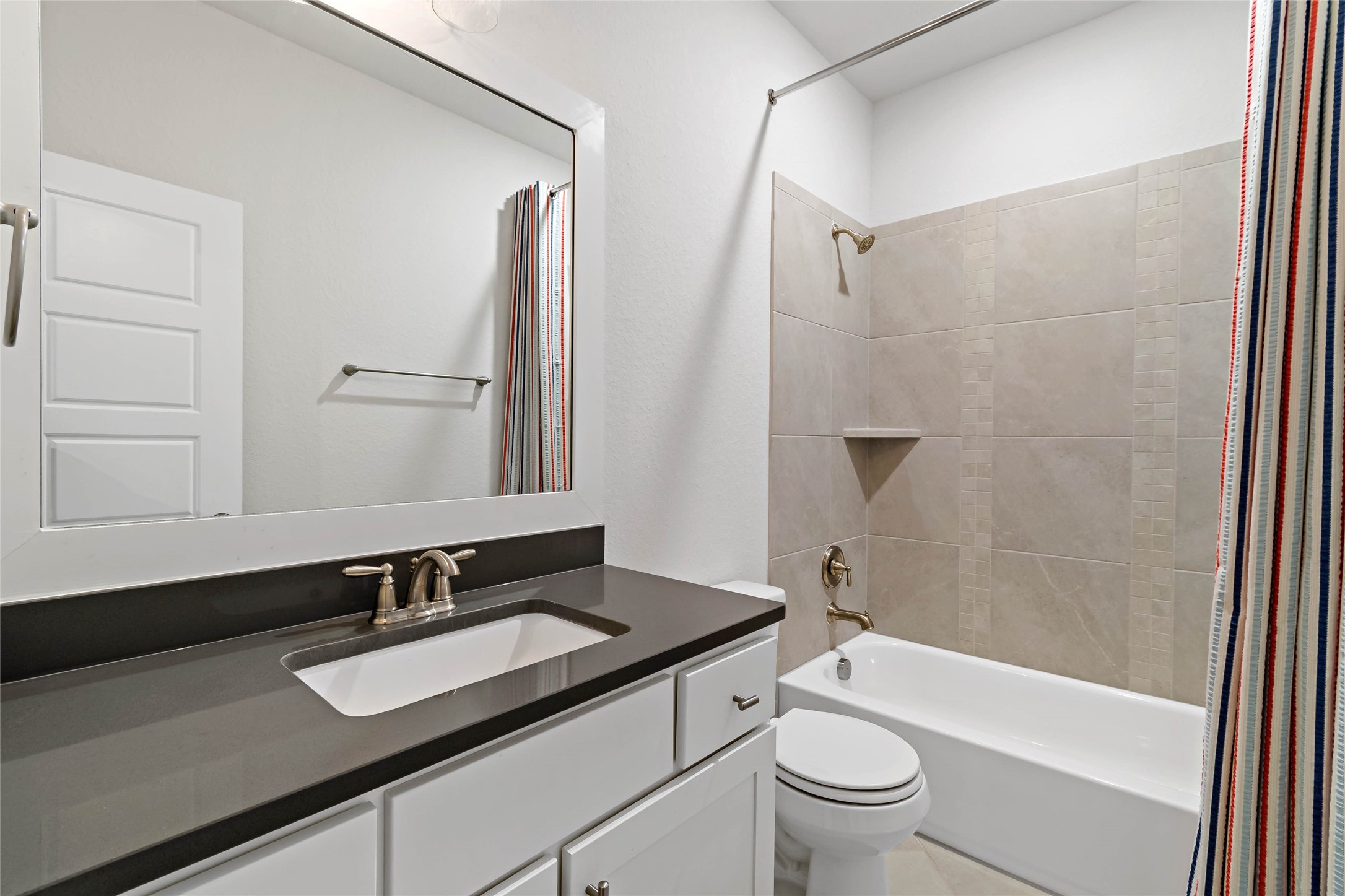 4802 Gingerwood Trace Lane Rosharon, TX 77583 - Photo 36 of 44 a bathroom with a granite countertop sink toilet and shower