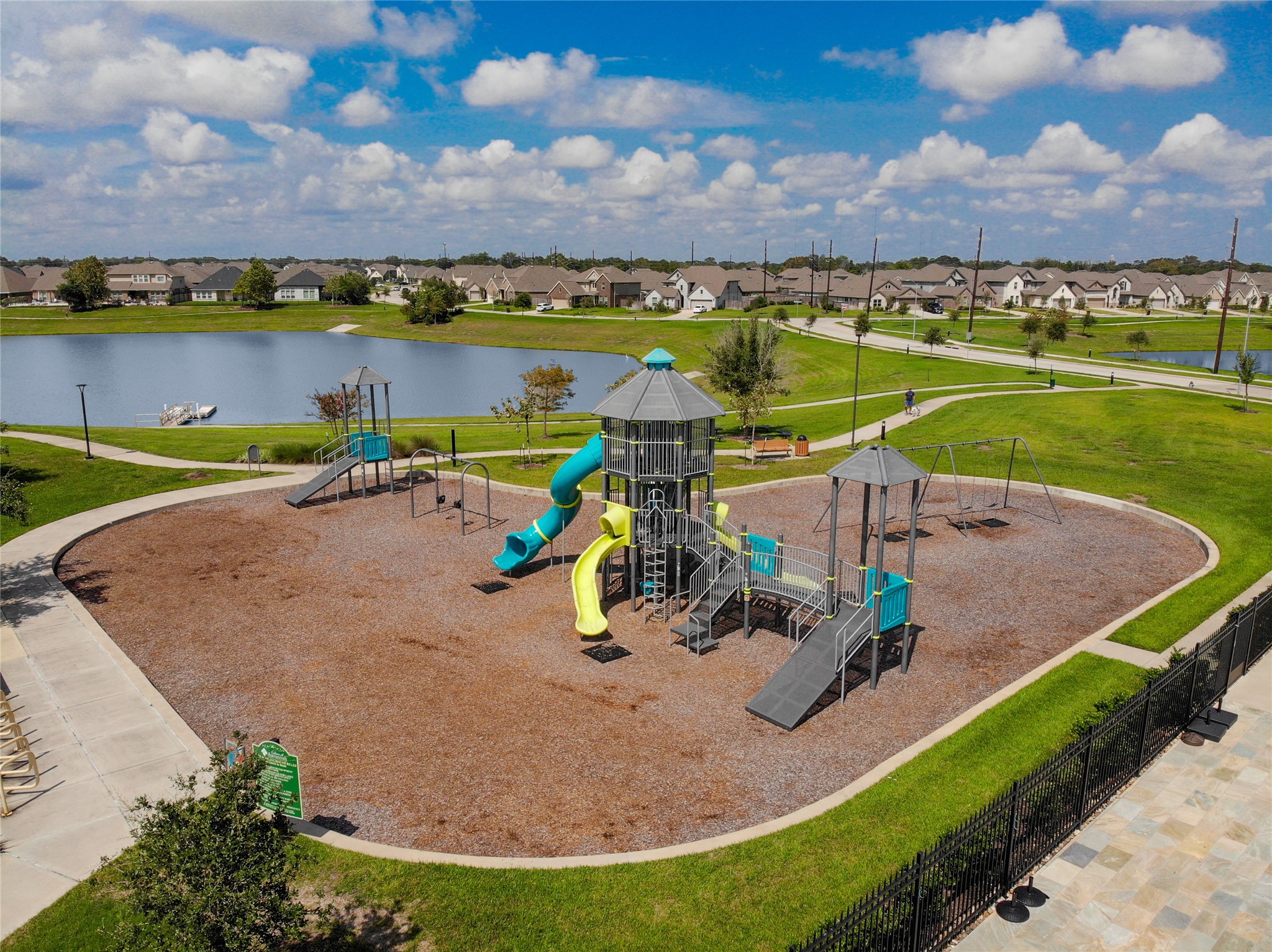 4802 Gingerwood Trace Lane Rosharon, TX 77583 - Photo 43 of 44 a view of a lake with a yard