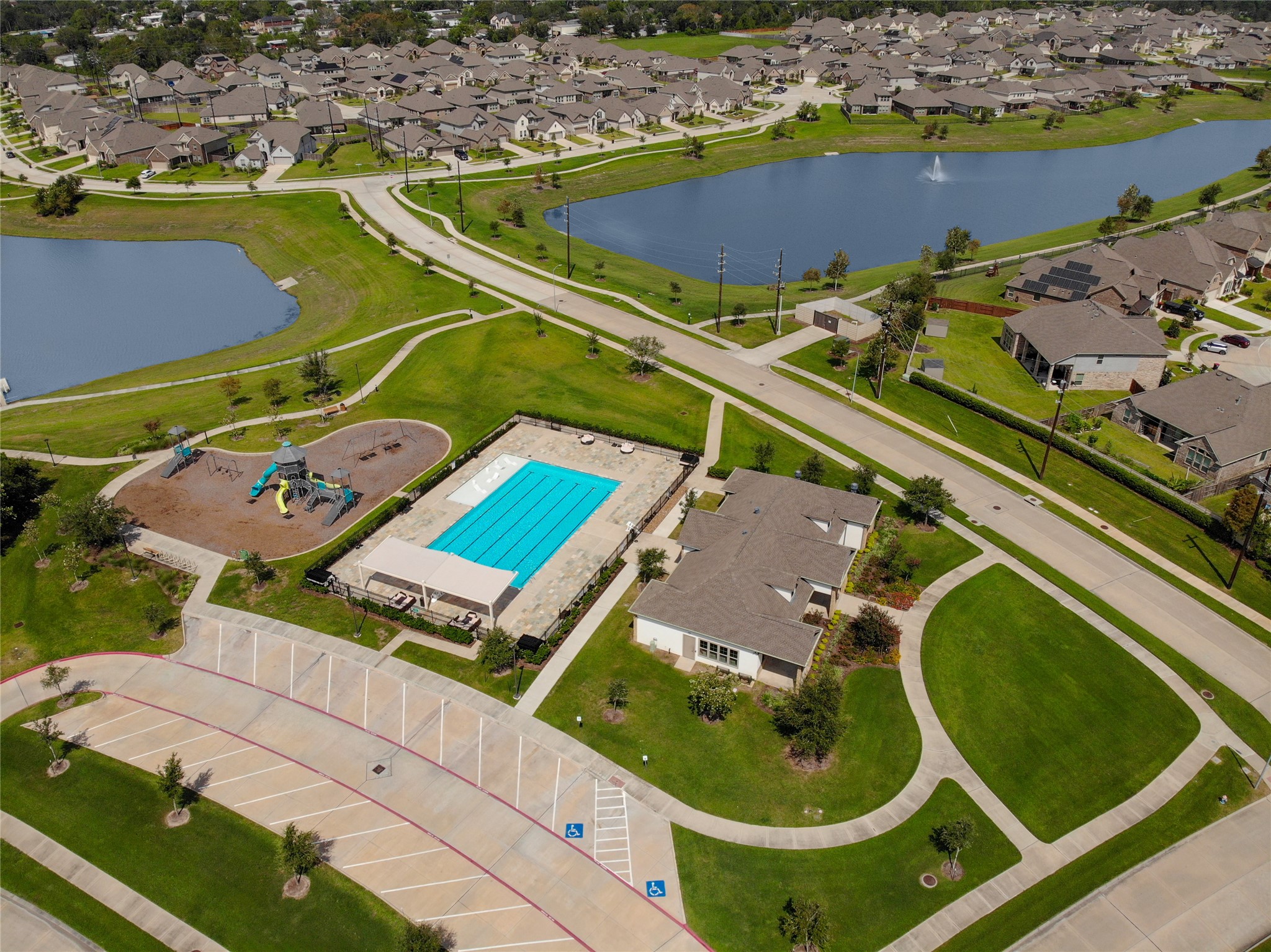 4802 Gingerwood Trace Lane Rosharon, TX 77583 - Photo 44 of 44 an aerial view of a tennis ground and a cars park side of the ocean