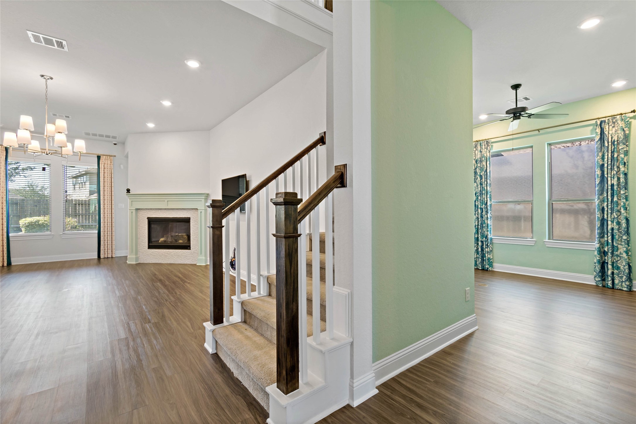 4802 Gingerwood Trace Lane Rosharon, TX 77583 - Photo 7 of 44 a view of a hallway with wooden floor and staircase