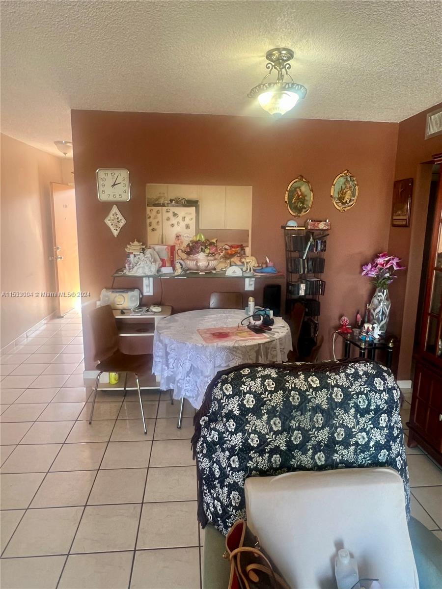 1075 West 68th Street, Unit 309 Hialeah, FL 33014 - Photo 14 of 21 a living room with furniture