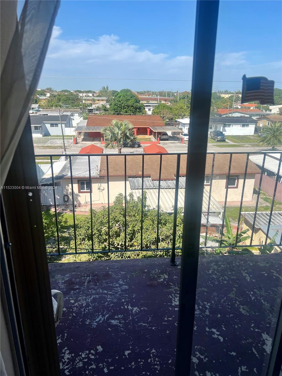 1075 West 68th Street, Unit 309 Hialeah, FL 33014 - Photo 2 of 21 a view of a city from a balcony