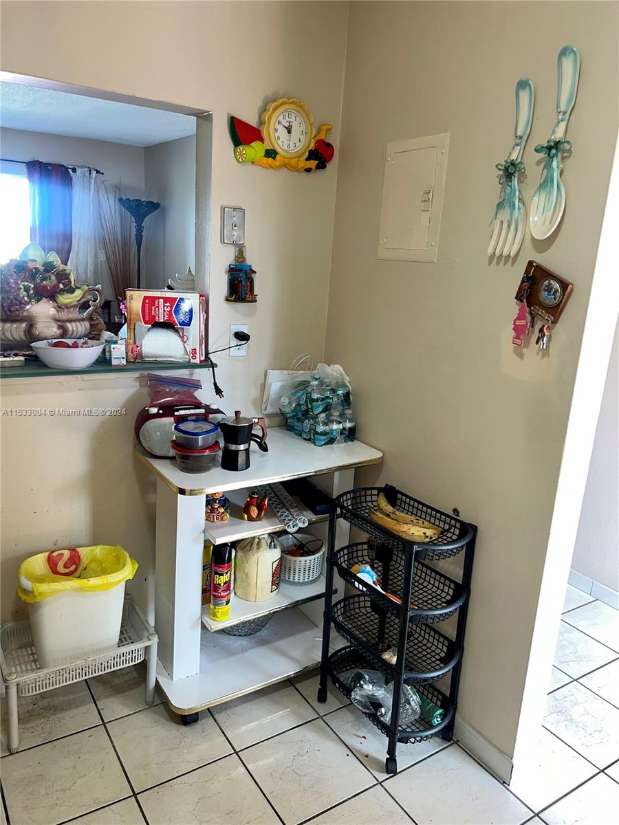 1075 West 68th Street, Unit 309 Hialeah, FL 33014 - Photo 7 of 21 a room with storage and utility