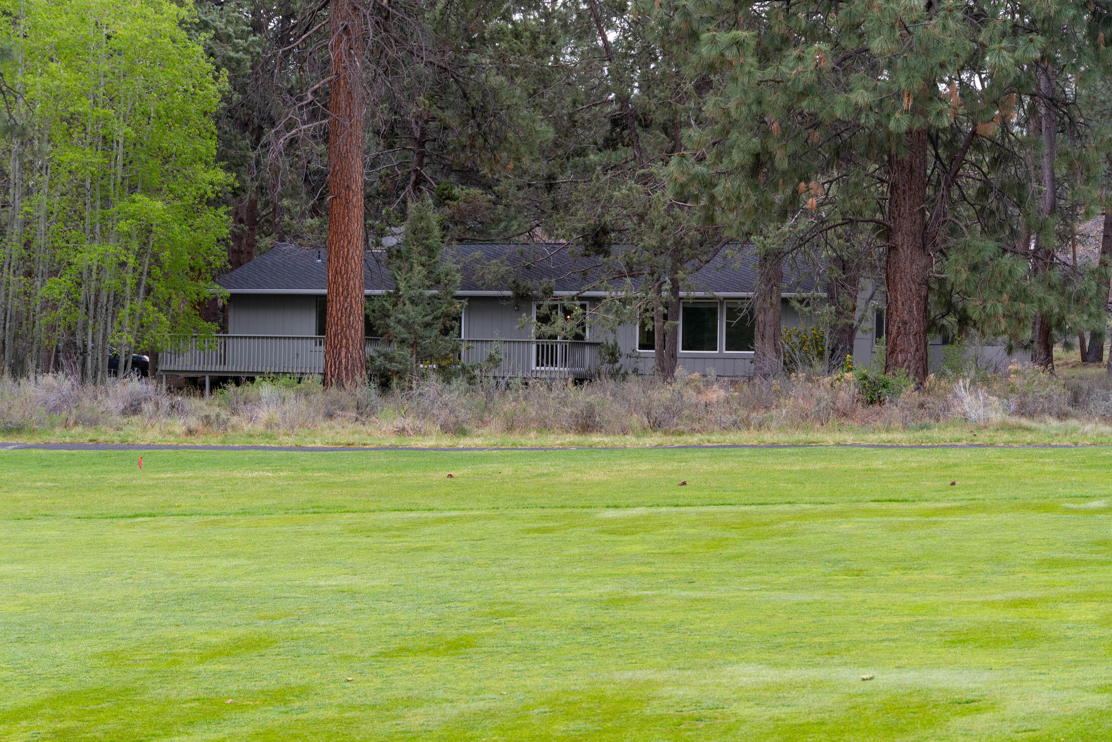 20316 Donkey Sled Road Bend, OR 97702 - Photo 35 of 50 a front view of house with yard and seating area