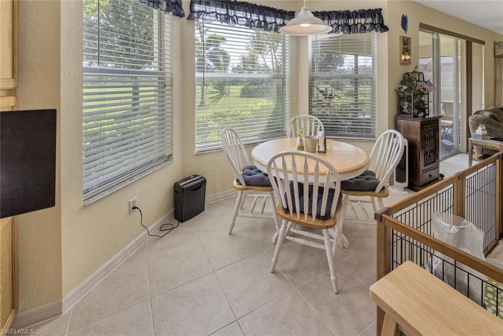 2084 Par Drive Naples, FL 34120 - Photo 12 of 29 a view of a dining room with furniture window and outside view