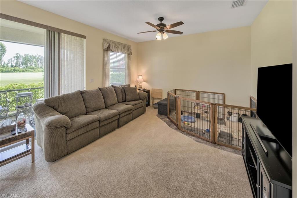 2084 Par Drive Naples, FL 34120 - Photo 13 of 29 a living room with furniture and a flat screen tv