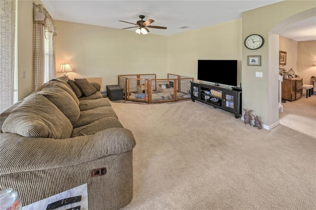 2084 Par Drive Naples, FL 34120 - Photo 14 of 29 a living room with furniture and a flat screen tv