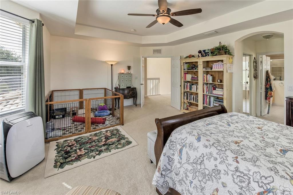 2084 Par Drive Naples, FL 34120 - Photo 18 of 29 a bedroom with bed and wooden floor