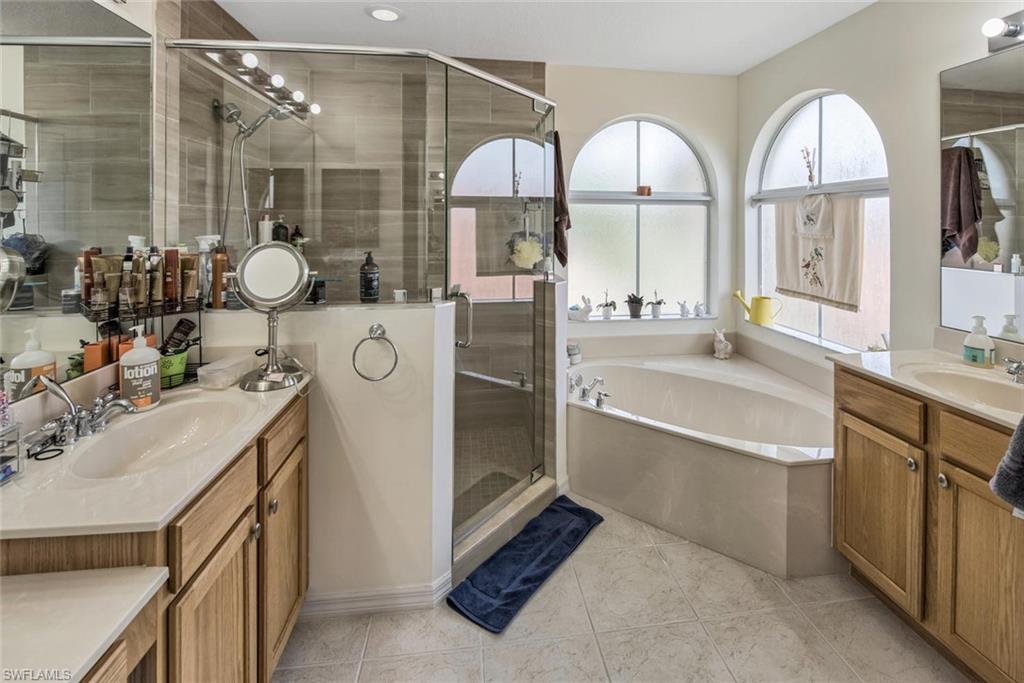 2084 Par Drive Naples, FL 34120 - Photo 19 of 29 a bathroom with double vanity and a mirror