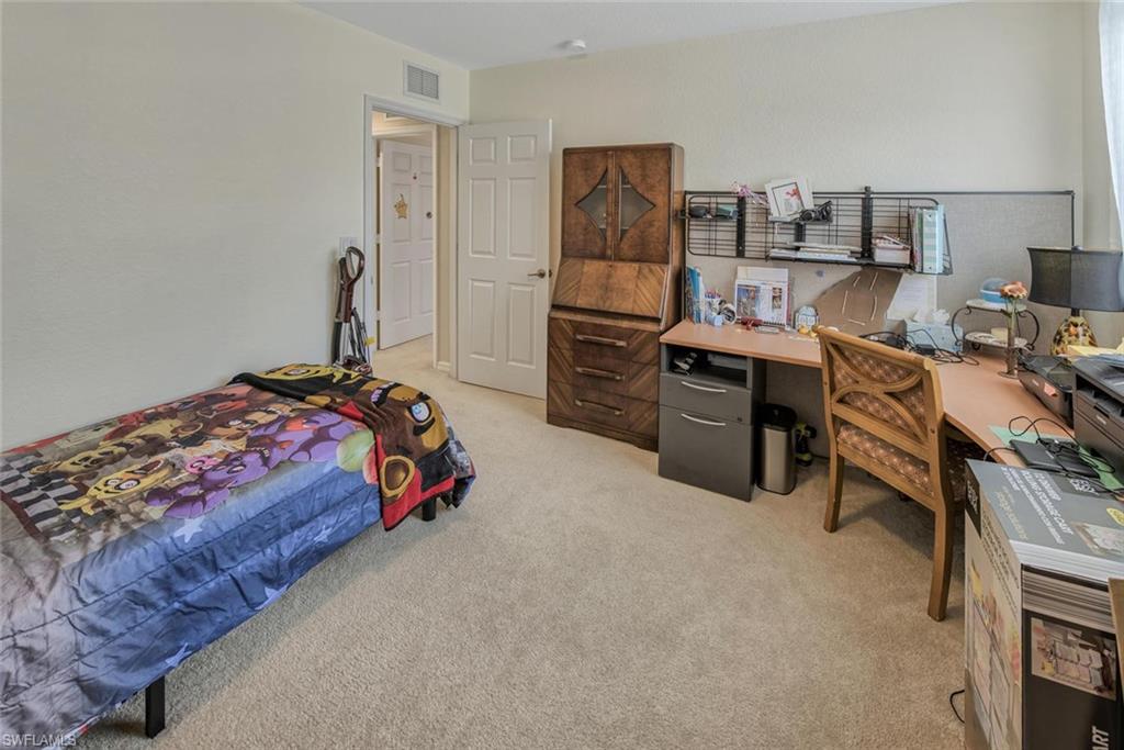 2084 Par Drive Naples, FL 34120 - Photo 23 of 29 a bedroom with a workspace