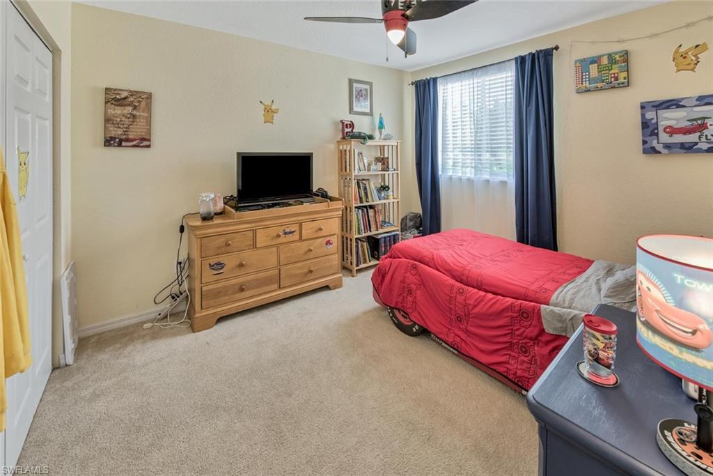 2084 Par Drive Naples, FL 34120 - Photo 24 of 29 a bedroom with a bed and furniture