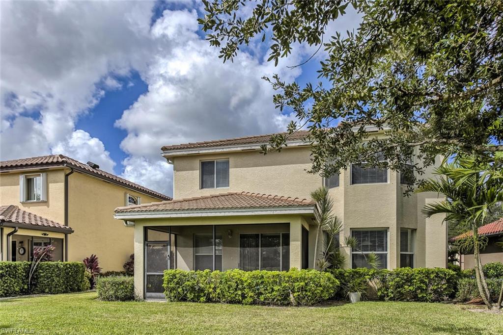 2084 Par Drive Naples, FL 34120 - Photo 25 of 29 front view of house with a yard