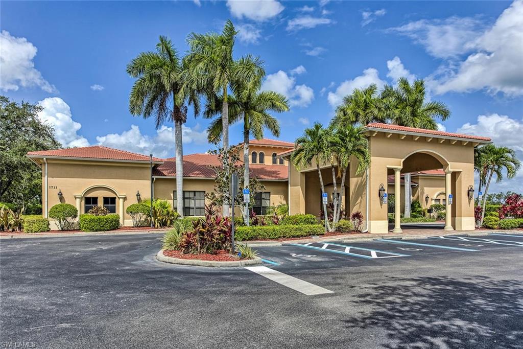 2084 Par Drive Naples, FL 34120 - Photo 27 of 29 front view of a house with a yard