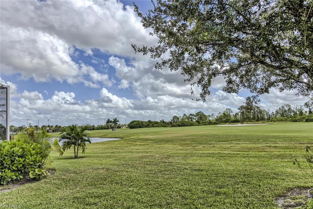 2084 Par Drive Naples, FL 34120 - Photo 3 of 29 a view of a lake with houses in the back