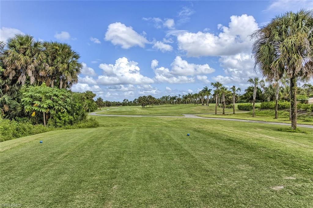 2084 Par Drive Naples, FL 34120 - Photo 4 of 29 a view of a golf course with a big yard