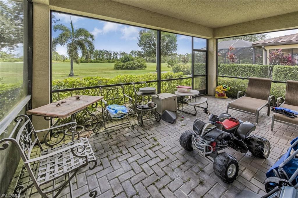 2084 Par Drive Naples, FL 34120 - Photo 5 of 29 a very nice looking living room with a large window