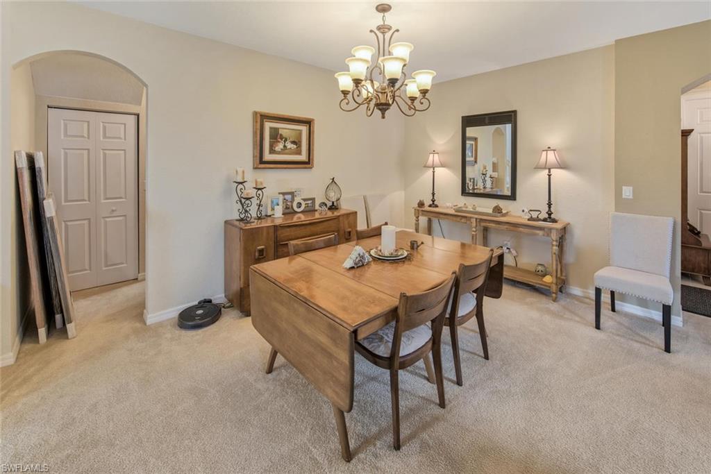 2084 Par Drive Naples, FL 34120 - Photo 9 of 29 a view of a dining room with furniture and a chandelier