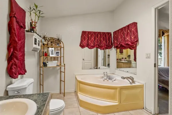 a bathroom with a bathtub and a sink