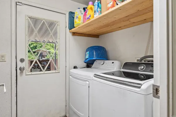 a utility room with dryer and washer