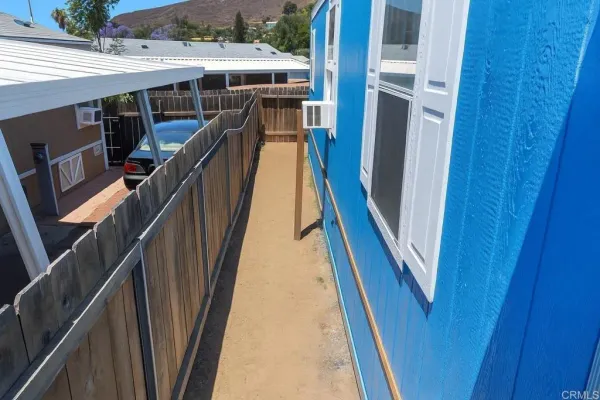 a view of backyard with seating space