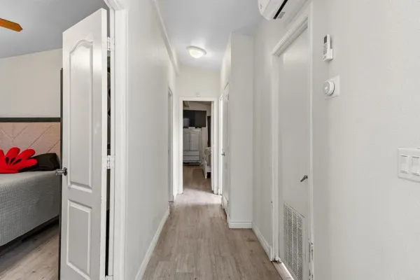 a view of a room with wooden floor and closet