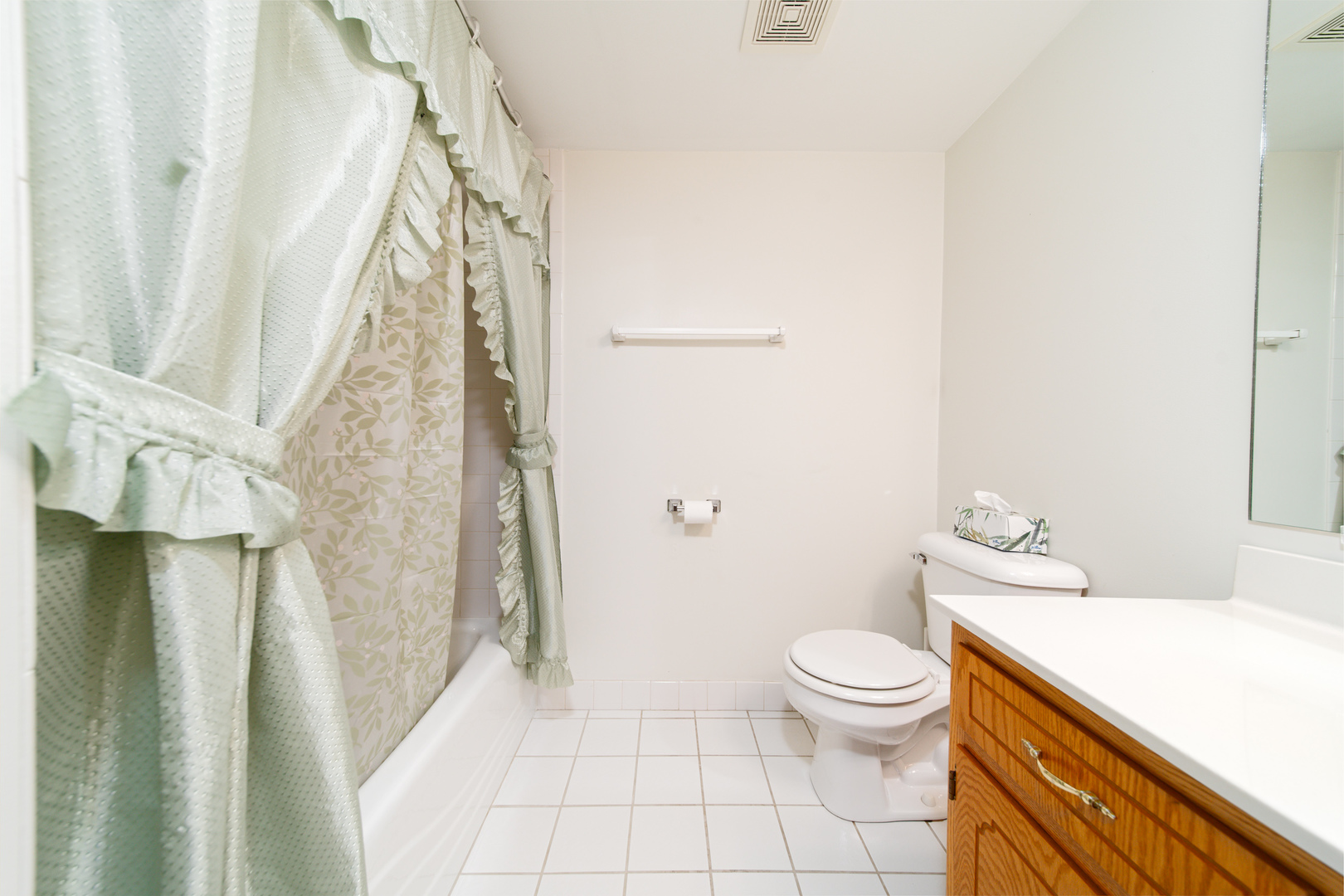 10640 Ridgeland Avenue, Unit 1C Chicago Ridge, IL 60415 - Photo 11 of 16 a bathroom with a granite countertop sink toilet and shower