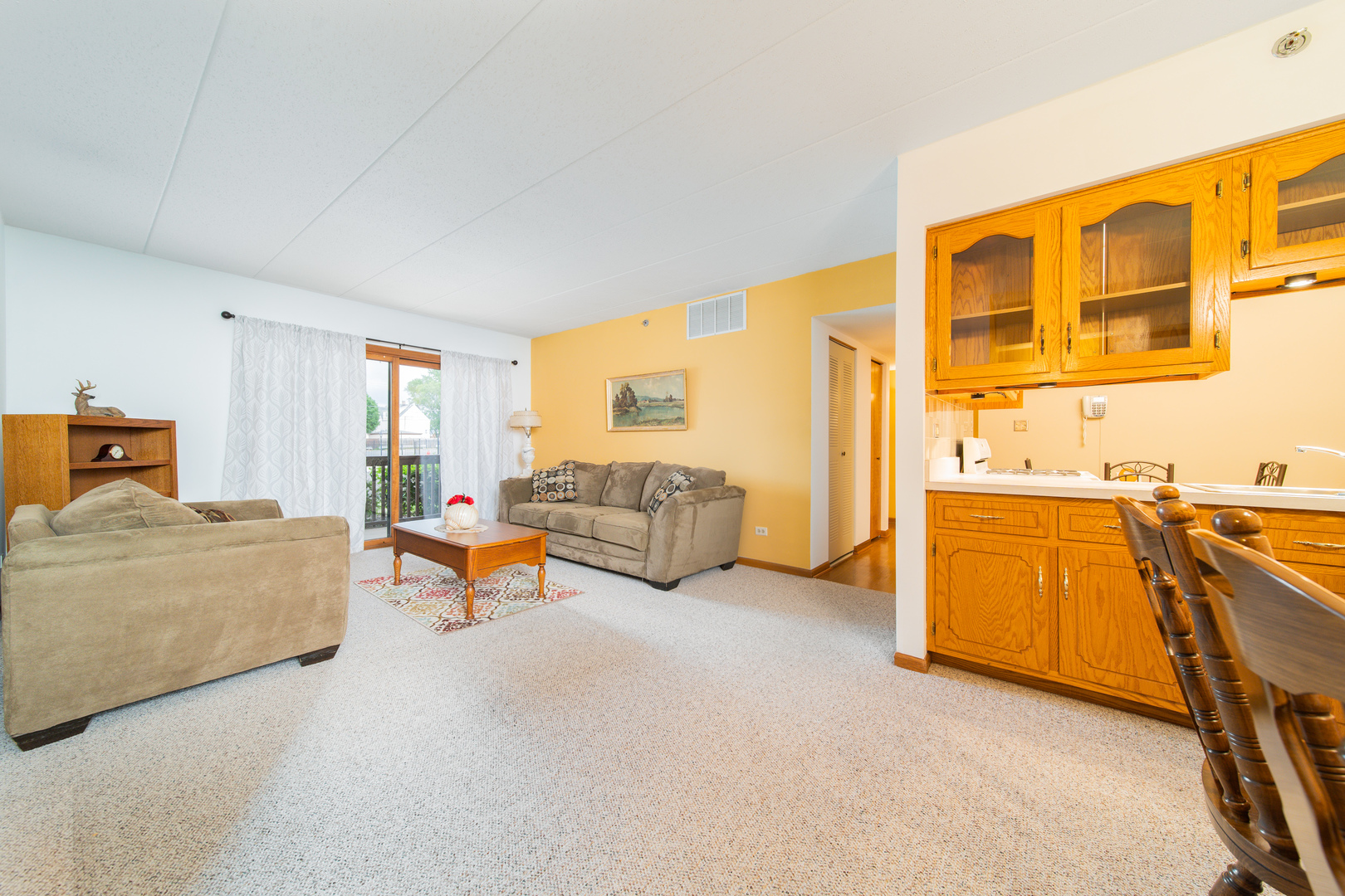 10640 Ridgeland Avenue, Unit 1C Chicago Ridge, IL 60415 - Photo 3 of 16 a bedroom with furniture and a large window