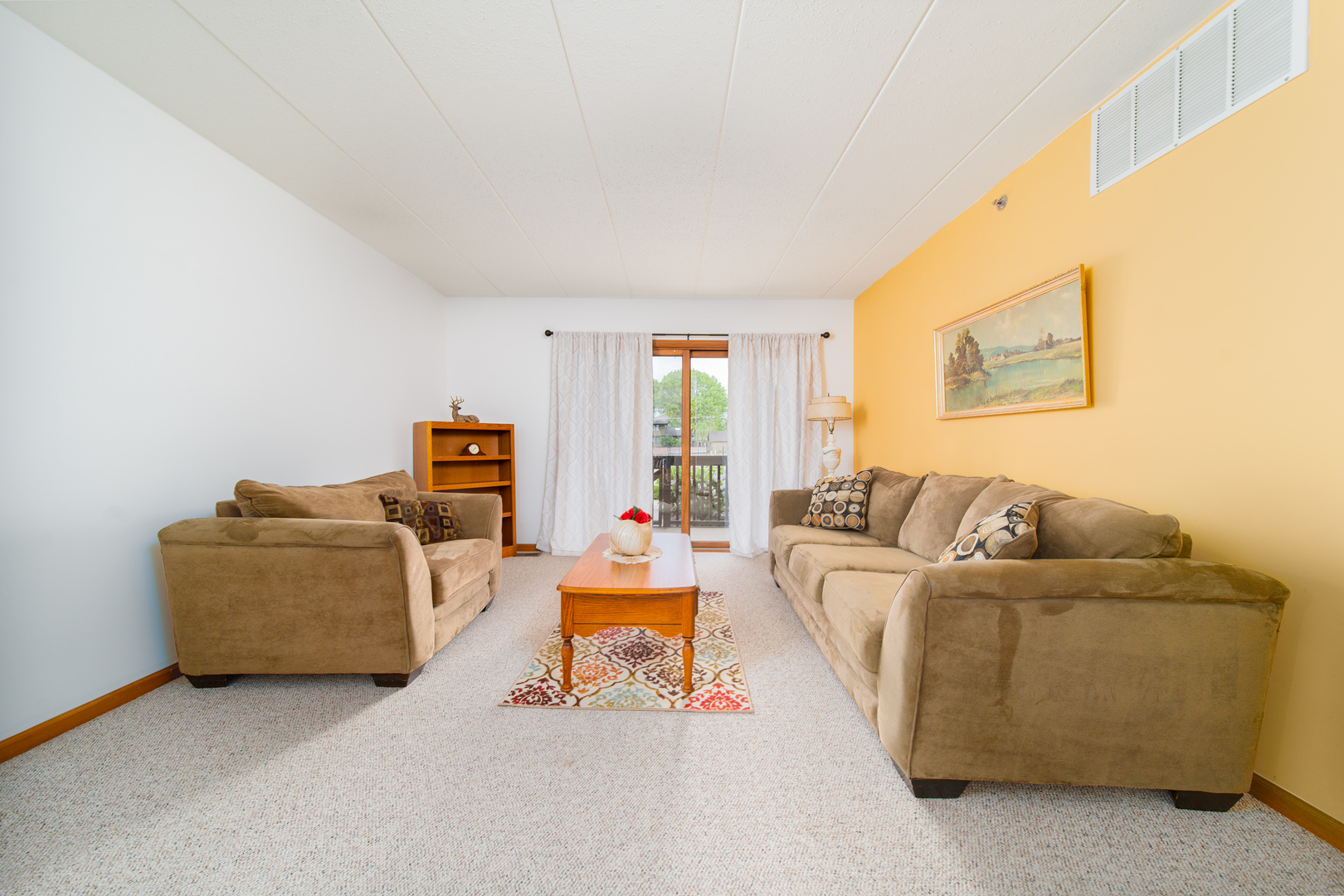10640 Ridgeland Avenue, Unit 1C Chicago Ridge, IL 60415 - Photo 4 of 16 a living room with furniture and a window