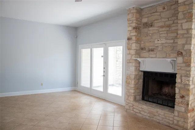 an empty room with a fireplace