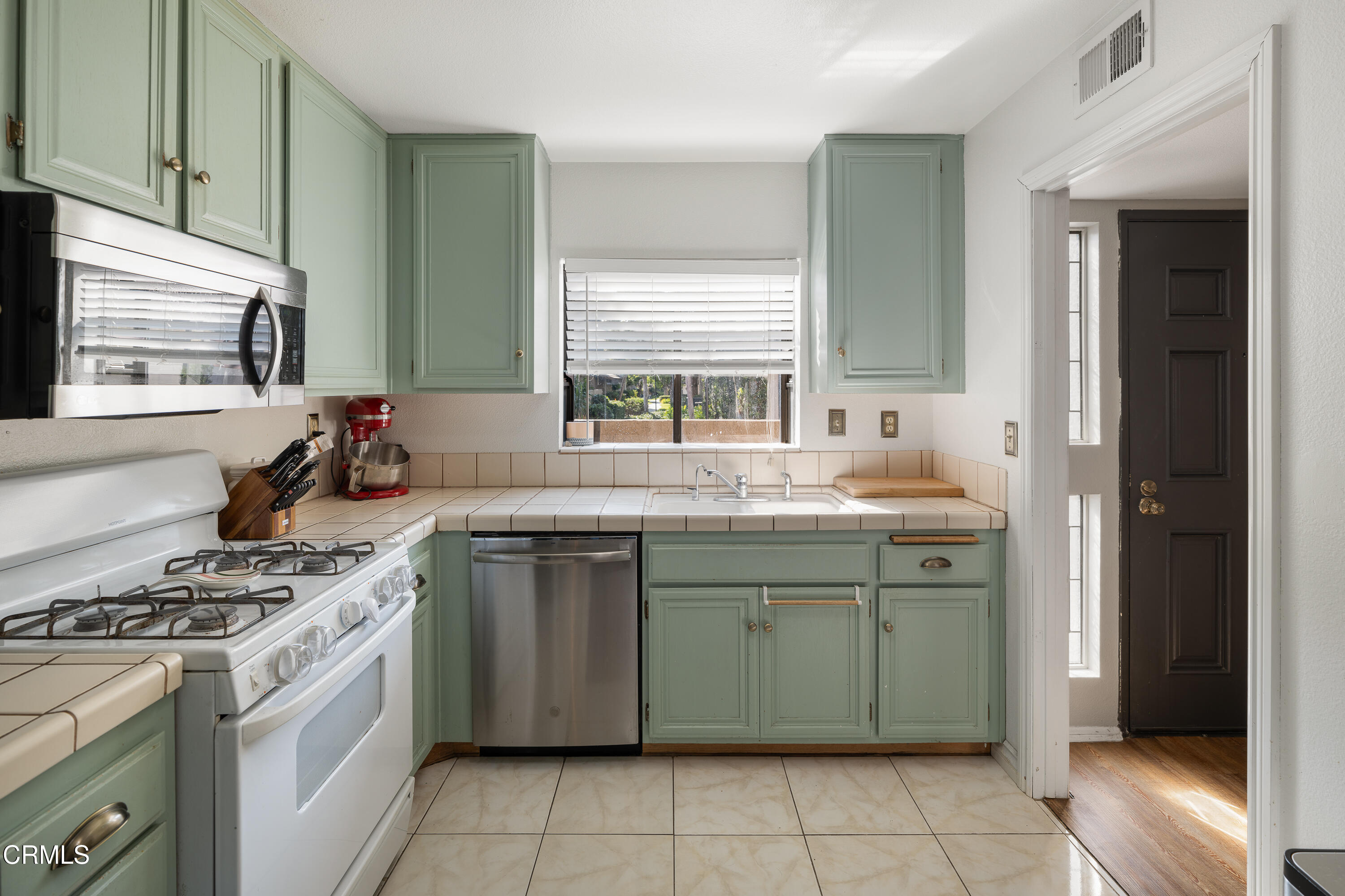 896 Swiss Trails Road Duarte, CA 91010 - Photo 12 of 33 a kitchen with a stove sink and cabinets