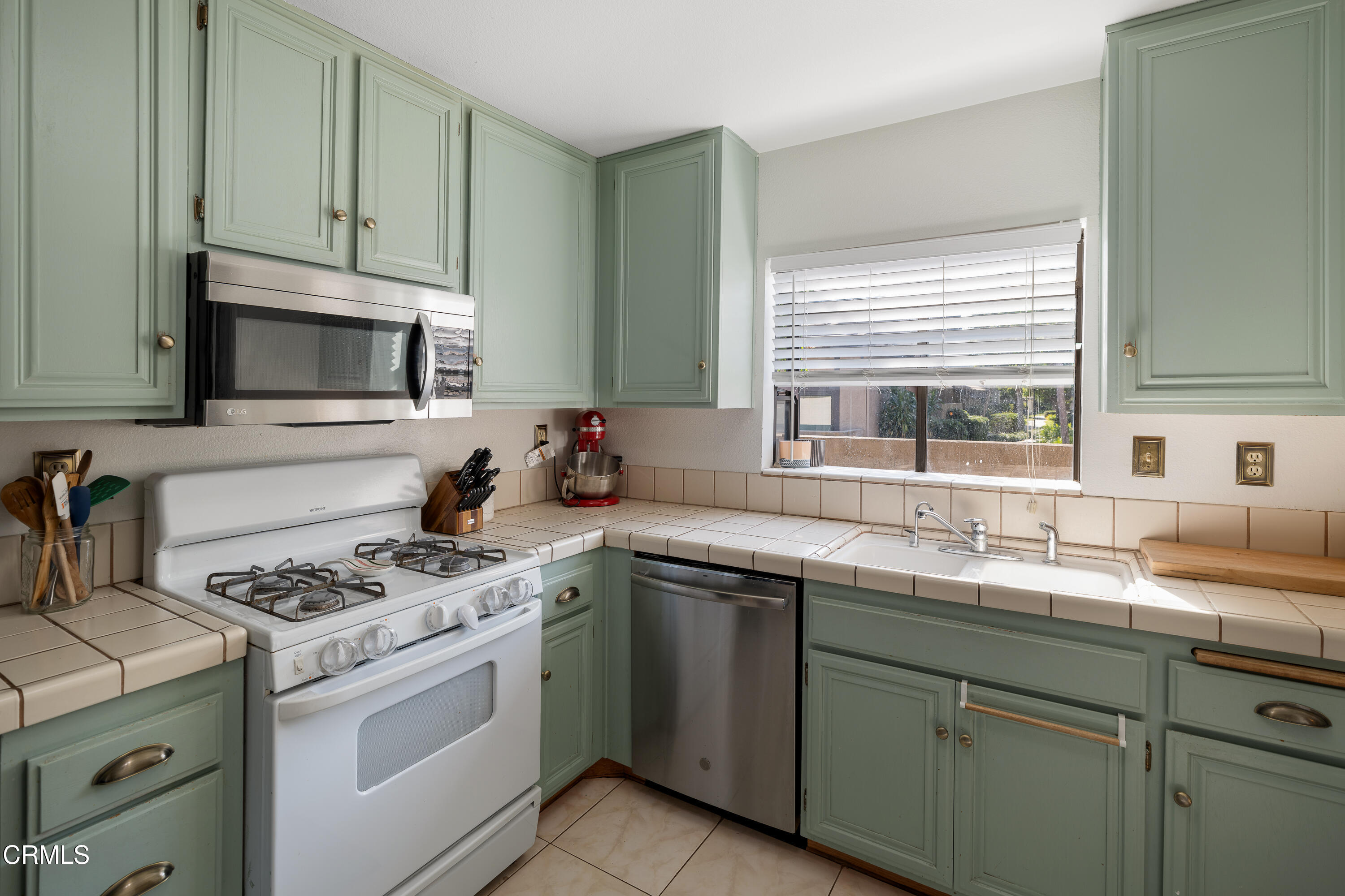 896 Swiss Trails Road Duarte, CA 91010 - Photo 13 of 33 a kitchen with cabinets appliances a sink and a window