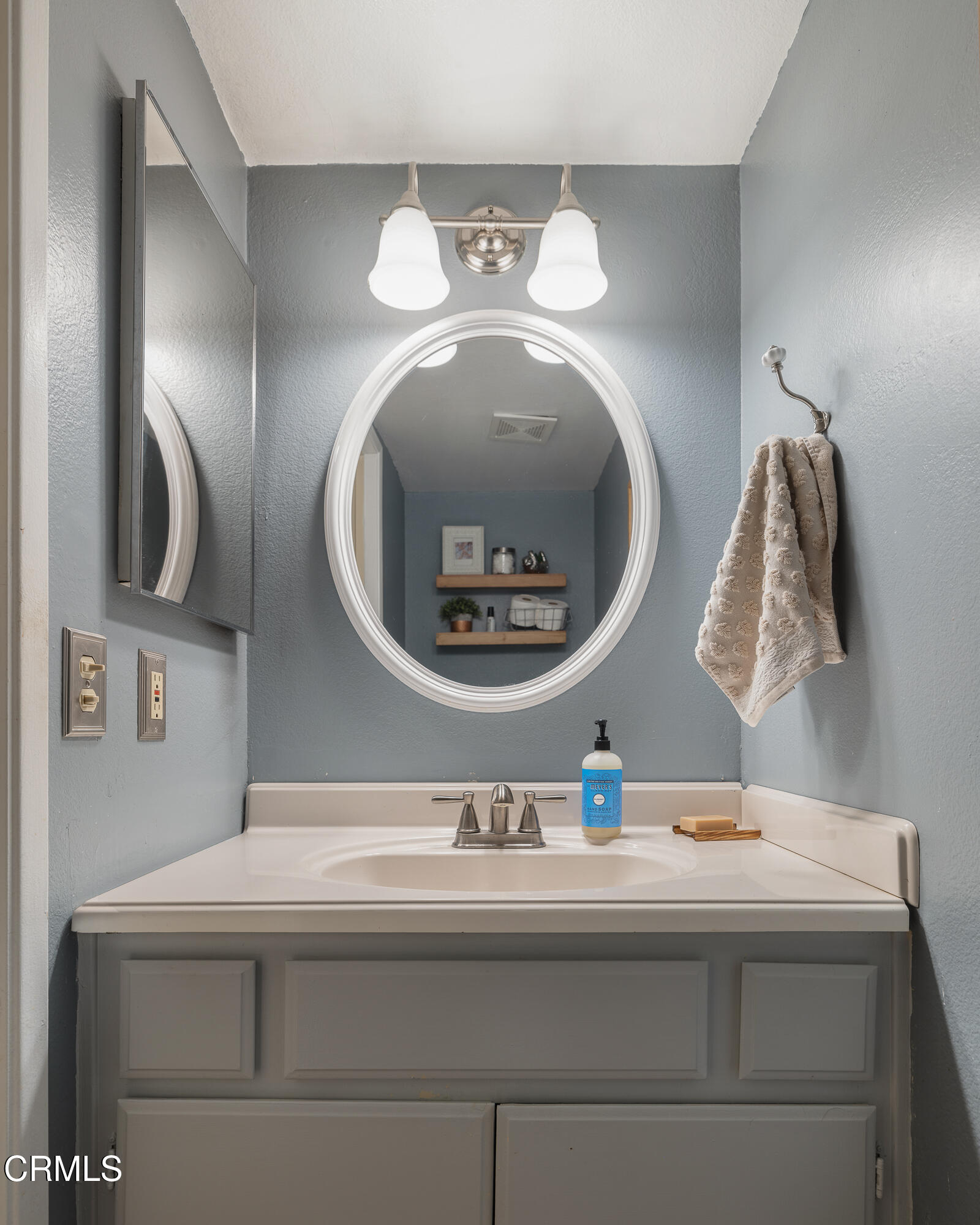 896 Swiss Trails Road Duarte, CA 91010 - Photo 16 of 33 a bathroom with a sink and a mirror