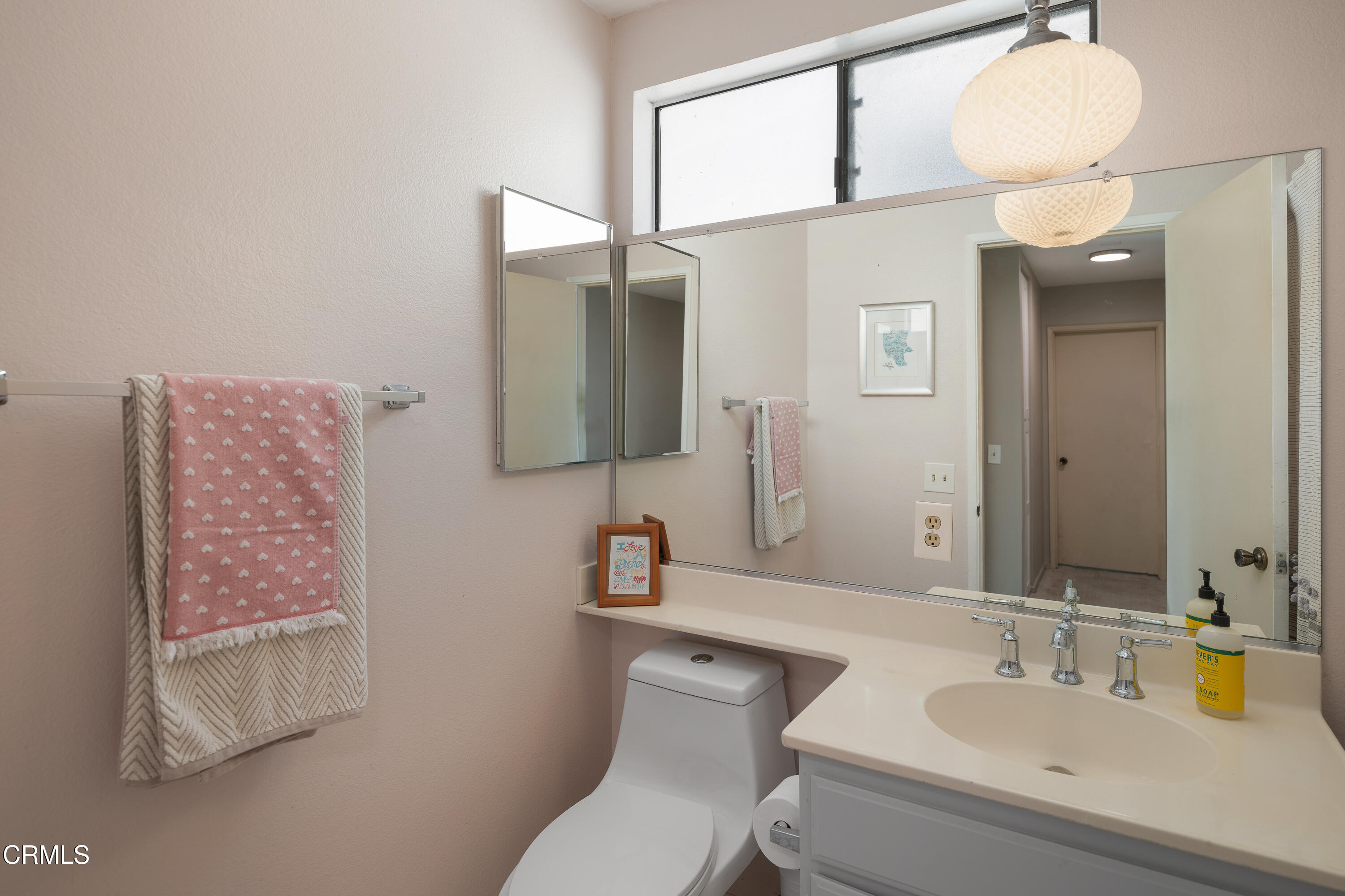 896 Swiss Trails Road Duarte, CA 91010 - Photo 25 of 33 a bathroom with a toilet sink and mirror