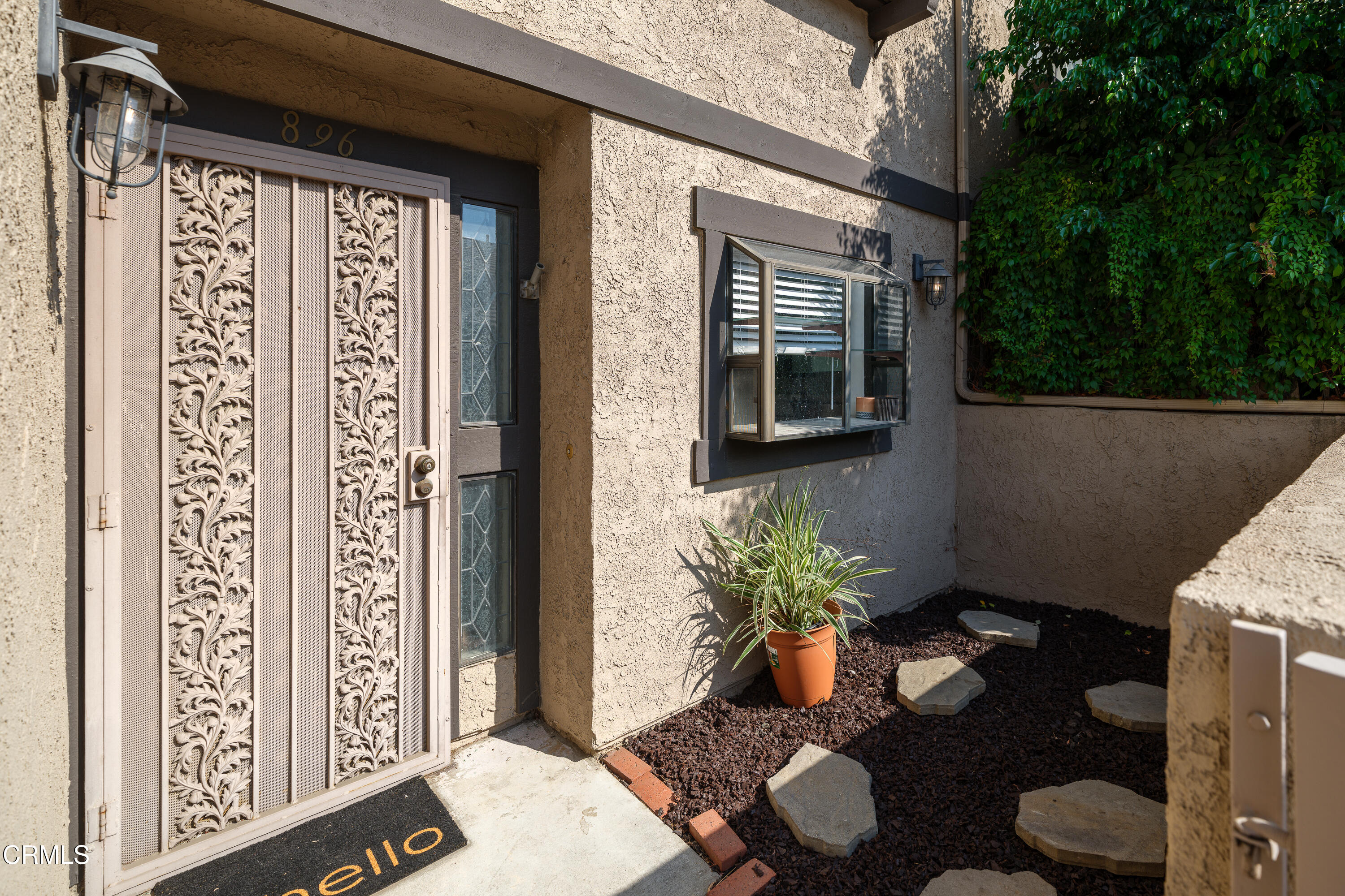 896 Swiss Trails Road Duarte, CA 91010 - Photo 3 of 33 a potted plant sitting in front of a house