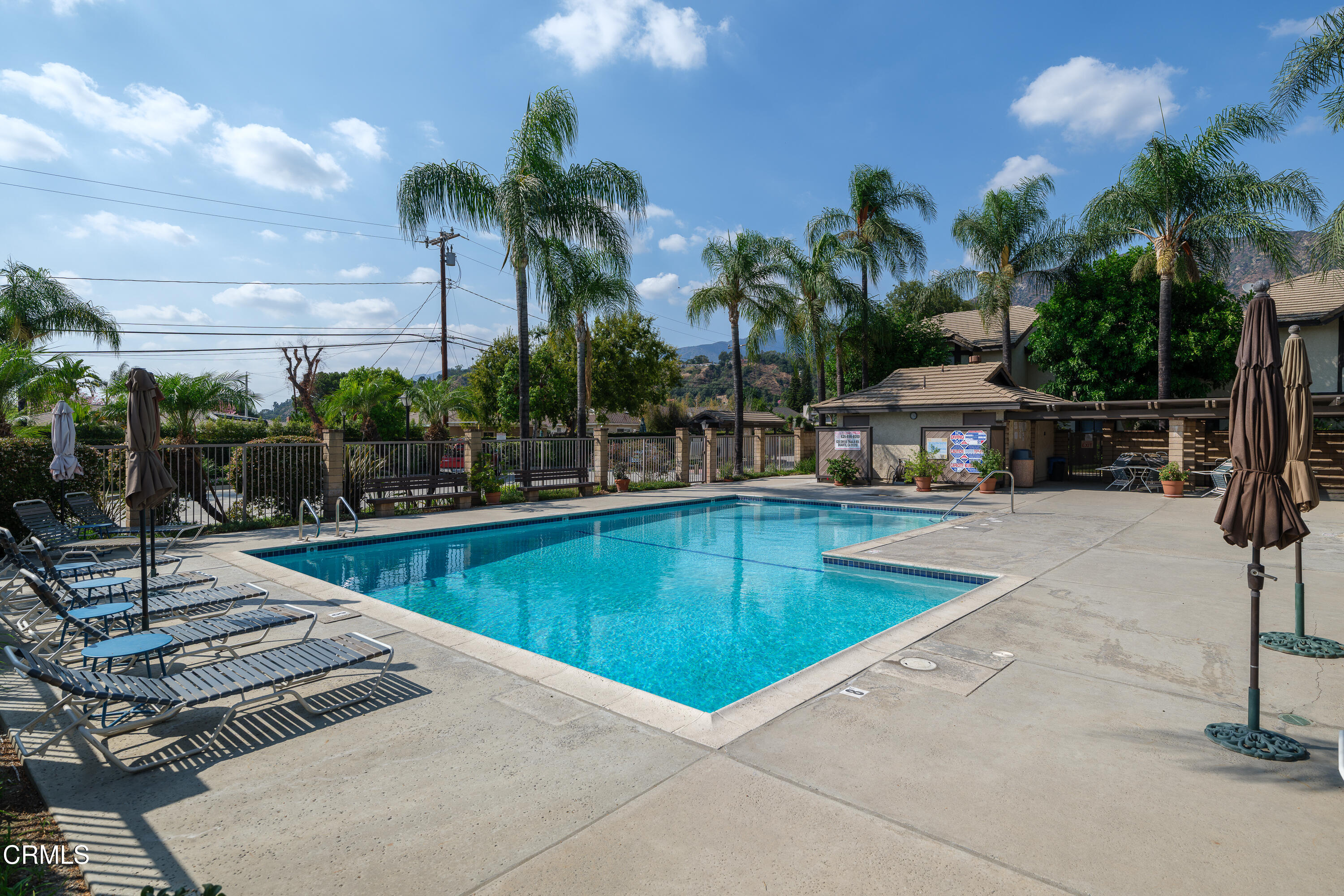 896 Swiss Trails Road Duarte, CA 91010 - Photo 31 of 33 a view of a swimming pool with a lounge chairs