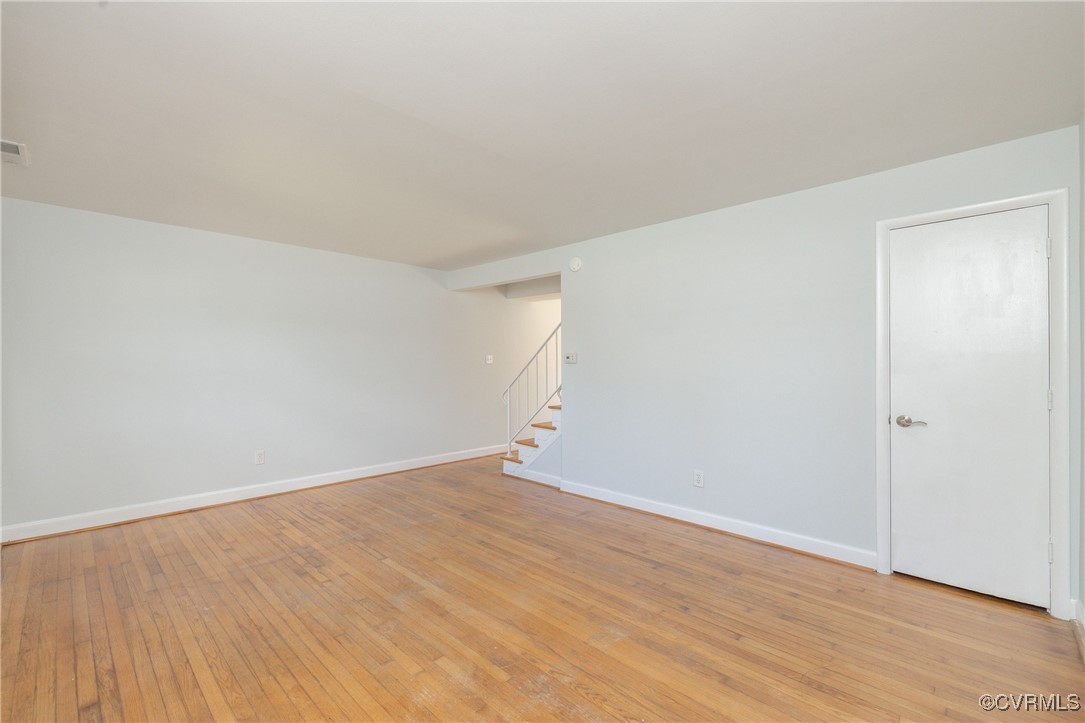 3109 North Parham Road, Unit 1 Henrico, VA 23294 - Photo 8 of 26 Unfurnished room featuring stairway, baseboards, a