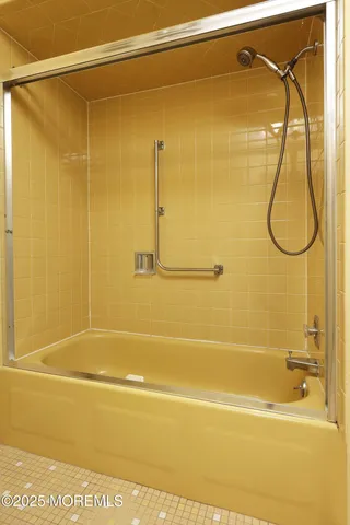 a bathroom with a shower and a shower