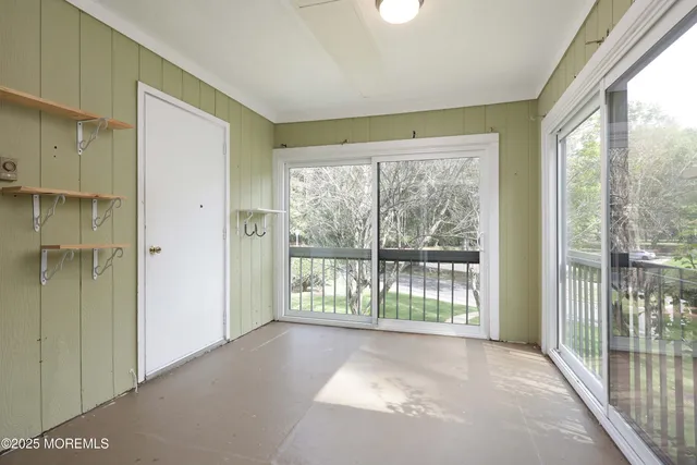 a view of entryway with wooden floor