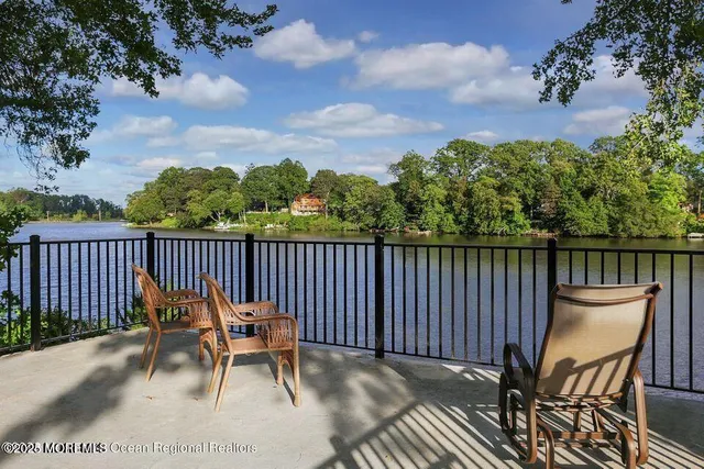a view of a chairs on wooden deck