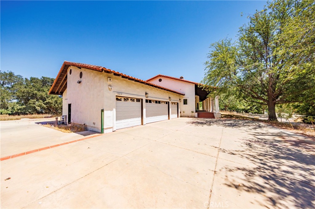 16515 Valley Ranch Road Canyon Country, CA 91387 - Photo 4 of 75 RV Parking to the left of the 4 car garage