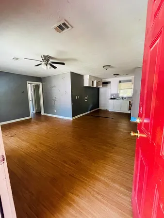 a view of a kitchen with a sink and cabinets