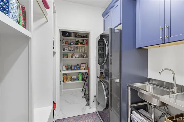 a kitchen with stainless steel appliances kitchen island granite countertop a table and chairs