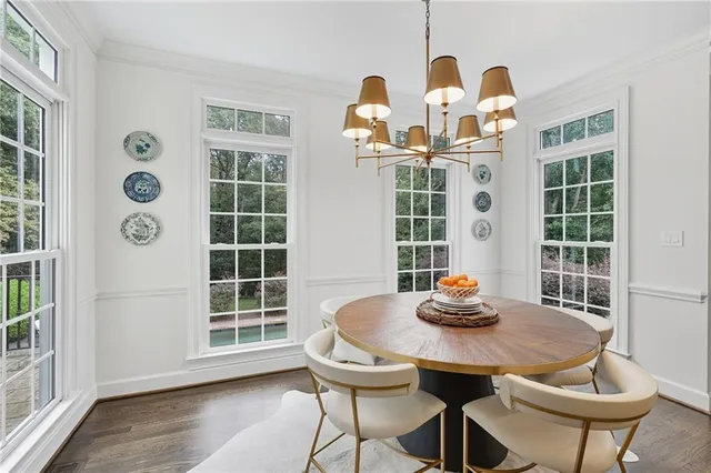 a view of a living room with furniture and wooden floor