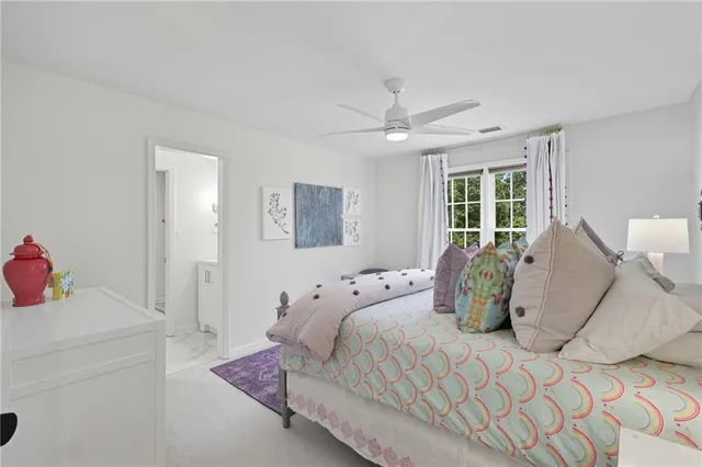 a view of a table and chairs in back yard of the house