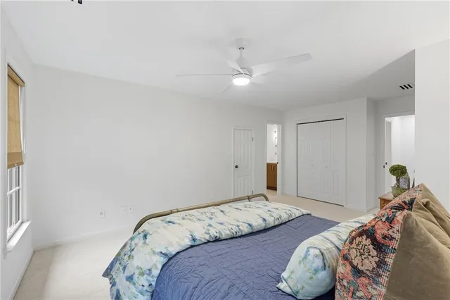 an aerial view of a house with a garden and trees