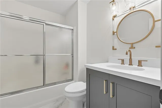 an aerial view of a house with garden space and street view