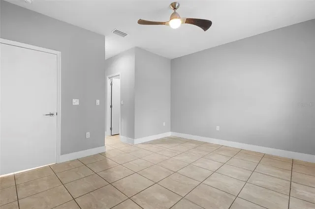 a view of an empty room and window