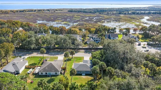 an aerial view of a house with a swimming pool