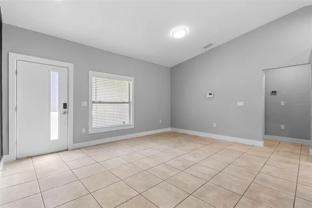 a view of an empty room and window